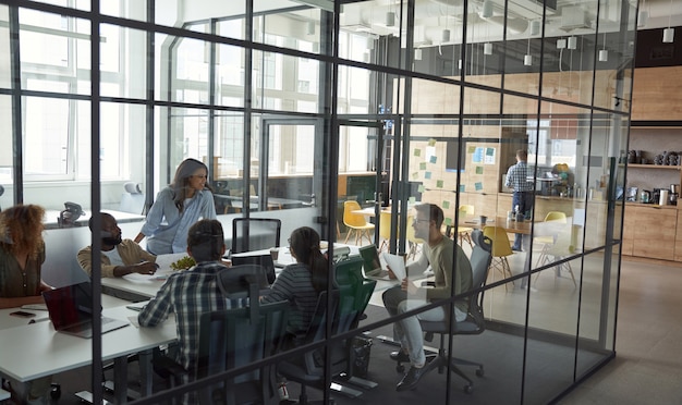 Business meeting group of happy smiling multiracial business people discussing project working