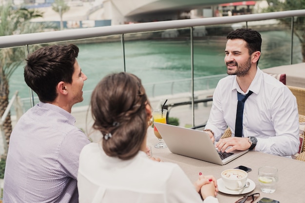 Business meeting on modern balcony