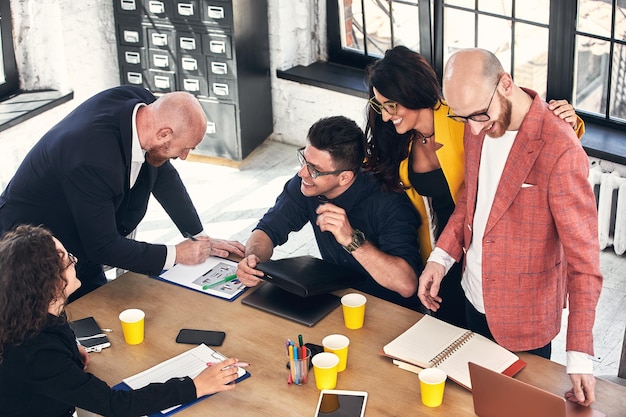 business meeting in an office the businesspeople are discussing a document