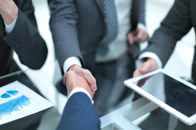 Business men shaking hands Closeup