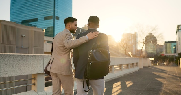 Business men and walking in street with support in city for partnership collaboration and teamwork Professional people and outdoor by buildings for travel commute and conversation and diversity