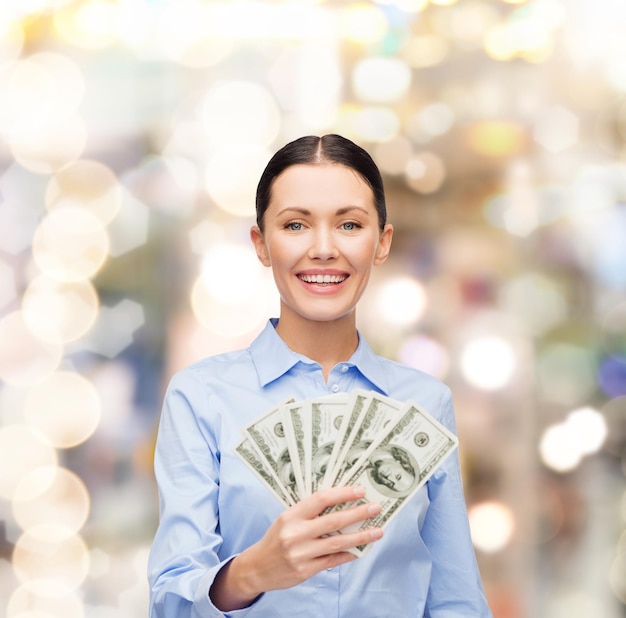 business and money concept - young businesswoman with dollar cash money