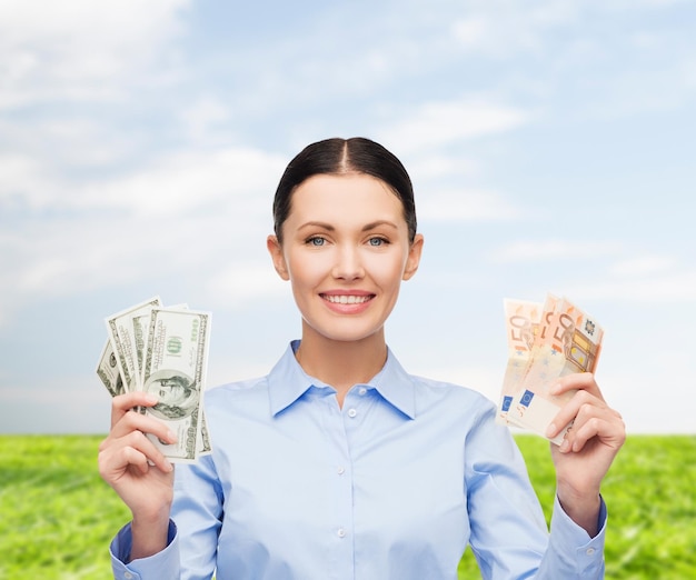 business and money concept - young businesswoman with dollar cash money