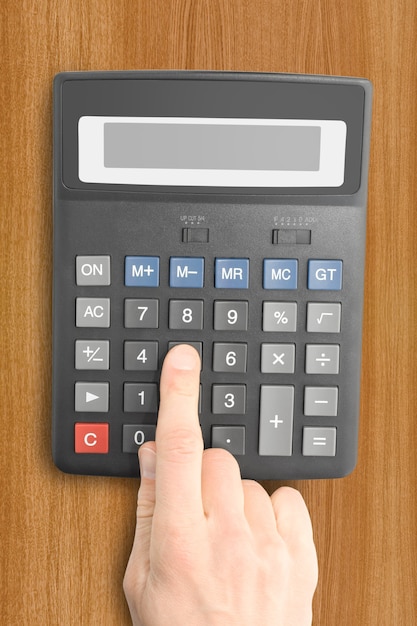 Business objects. electronic calculator with a hand