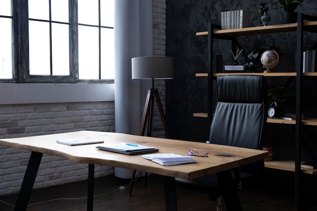 Photo business office work place with heavy wooden table