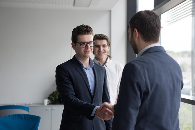 Business Partner Shake Hands on meetinig in modern office building