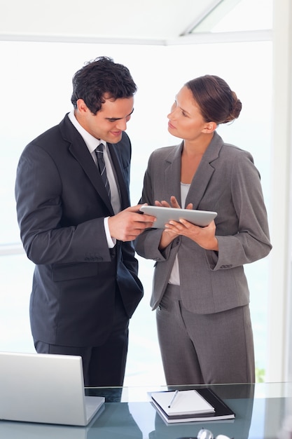 Business partner working on tablet together