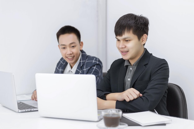 Business partners concept a young businessman talking to his colleague about a marketing plan