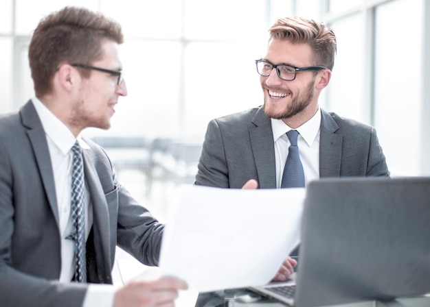 Business partners discussing business document