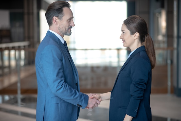 Business partners in formal clothing at work