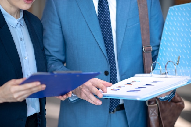 Photo business partners in formal clothing at work