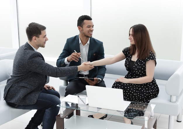 Business partners shake hands after signing the contract .concept of partnership