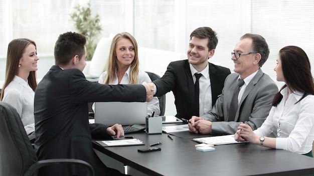 business partners shaking hands after a successful transaction.concept of partnership