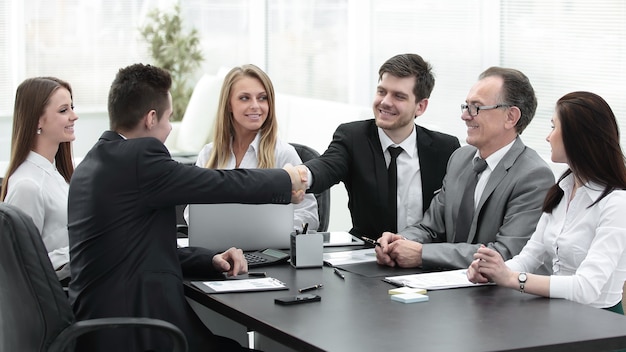 Business partners shaking hands after a successful transaction.concept of partnership