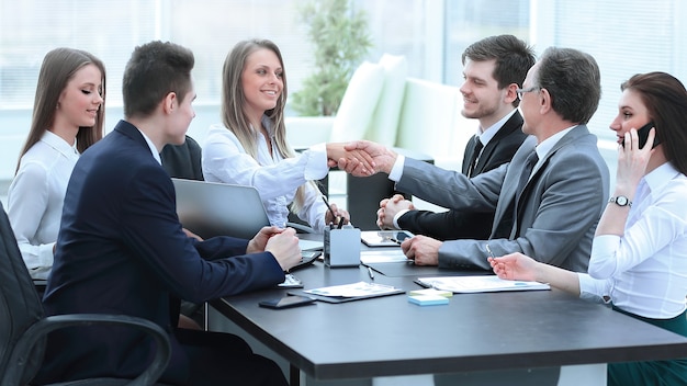 Business partners shaking hands after a successful transaction