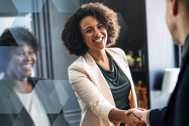 business partners shaking hands in agreement
