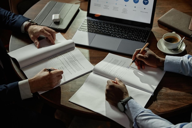 Business partners signing contract at meeting