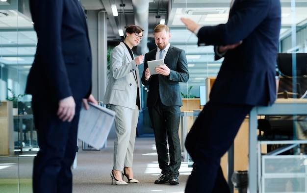 Business partners using tablet pc at work