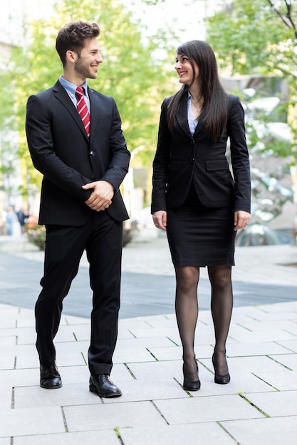 Business partners walking and talking