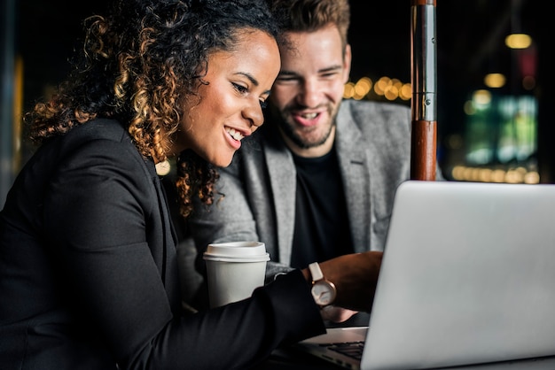 Business partners working together at a cafe