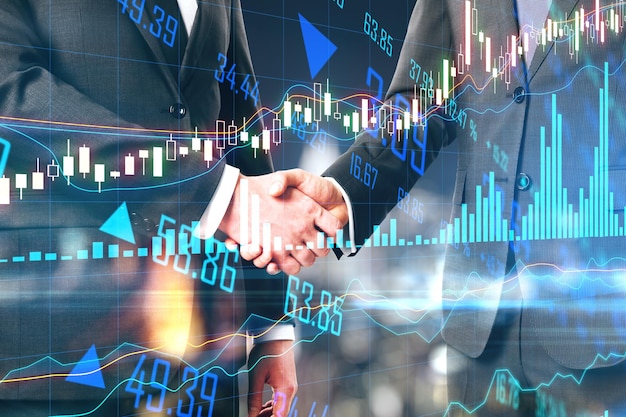 Business partnership concept with businessman handshaking and online stock market chart on digital screen with financial graphs and lines Double exposure