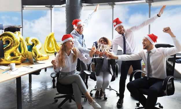 Business people are celebrating Happy New Year 2024 in modern office