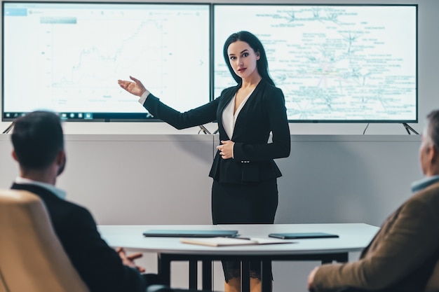 The business people are meeting in the modern office