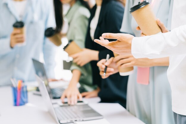 Business people are standing together for a break