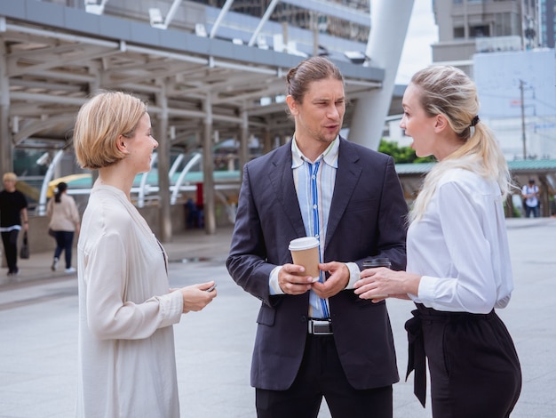 Photo business people are talking outside the office,outdoor meeting