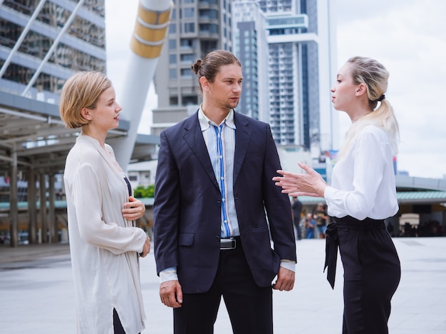 Business people are talking outside the office