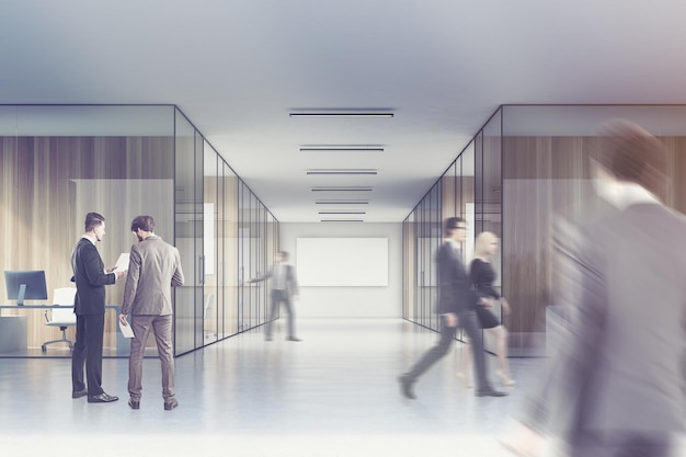 Business people are walking in a long office corridor with a poster hanging in the farthest corner. There are meeting rooms with glass walls. 3d rendering, mock up