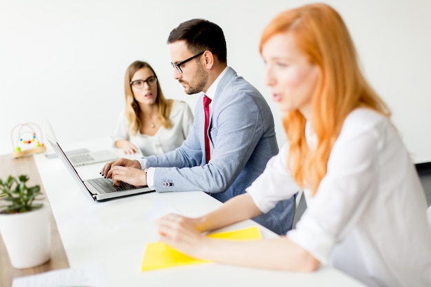 Business people around table during staff meeting