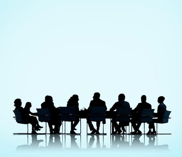 Photo business people in a board room meeting