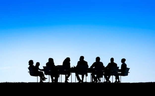 Photo business people in a board room meeting