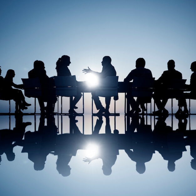 Photo business people in a board room meeting