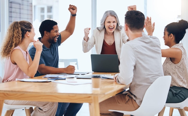 Business people celebration meeting goal target and success while cheering during a meeting in a office advertising and marketing team happy about company profit and bonus salary from project