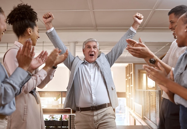 Photo business people celebration and winning with applause for promotion success or teamwork at office happy senior businessman in joy for win victory or achievement with team clapping at workplace