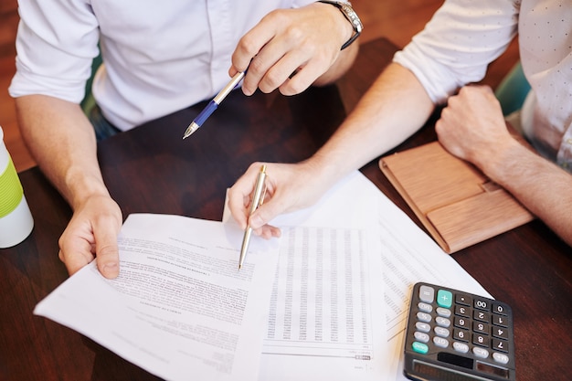 Business people checking financial documents