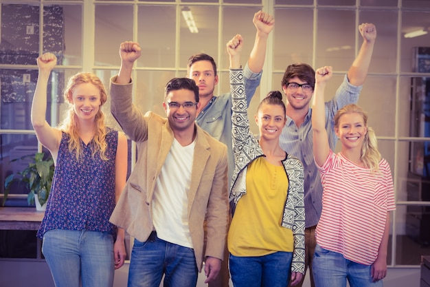 Business people cheering at the camera