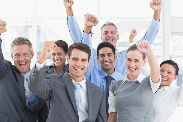 Business people cheering in office