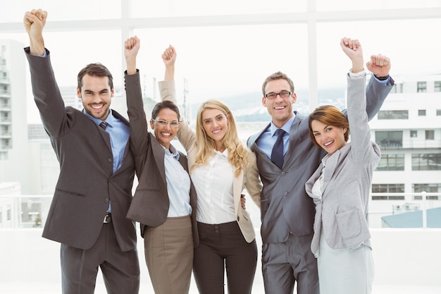 Business people cheering in office