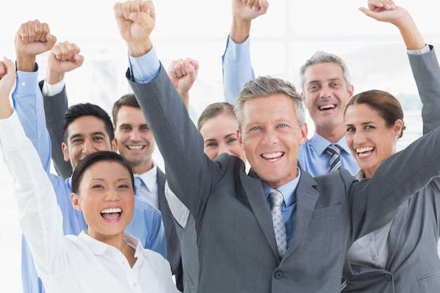 Business people cheering in office