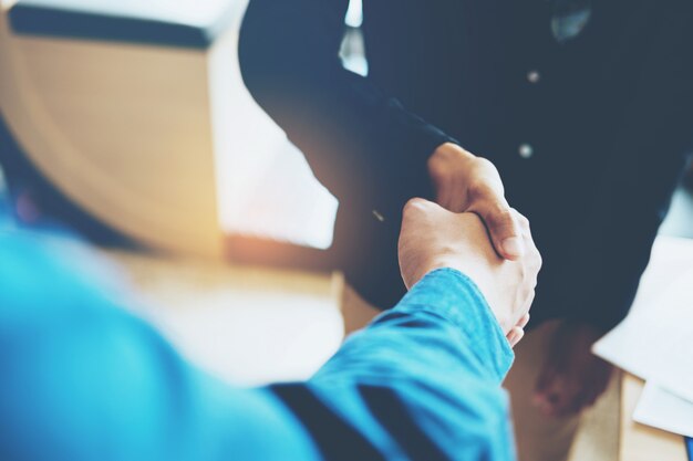 Business people colleagues shaking hands meeting 