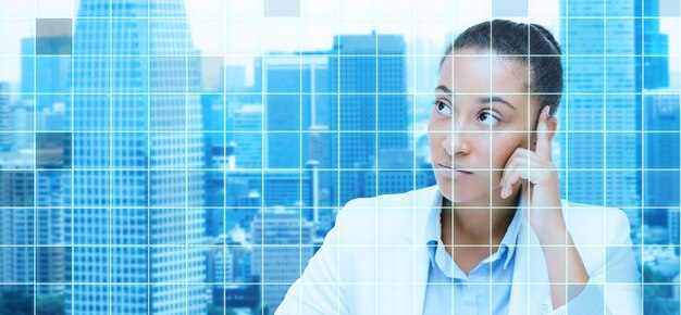 business and people concept - african american businesswoman looking up and thinking over city and blue grid background