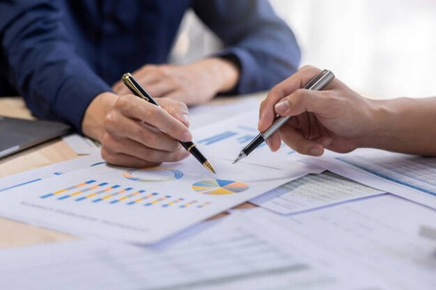 Photo business people consulting meeting working graphs and charts to account analyze market data and brainstorming new business project finance investment concept
