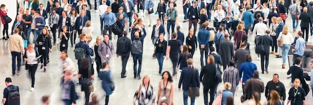 Business people crowd at a tradeshow, banner size. ideal for\
websites and magazines layouts