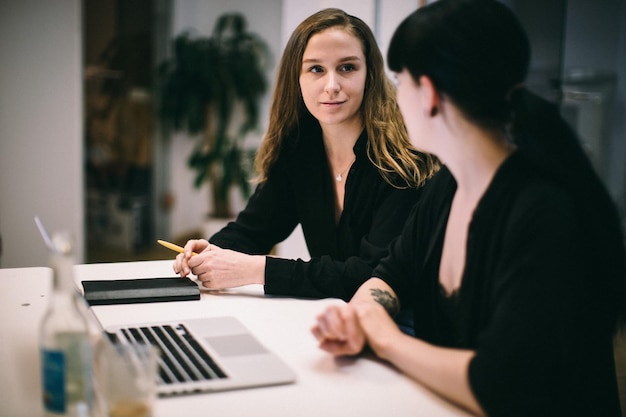 business people discussing at desk in office