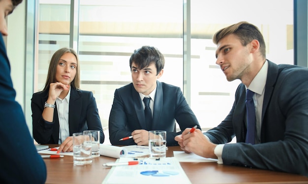 Business people discussing together in conference room during meeting at office