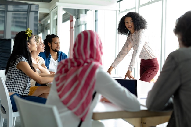 business people discussing with each other at conference room in a modern office