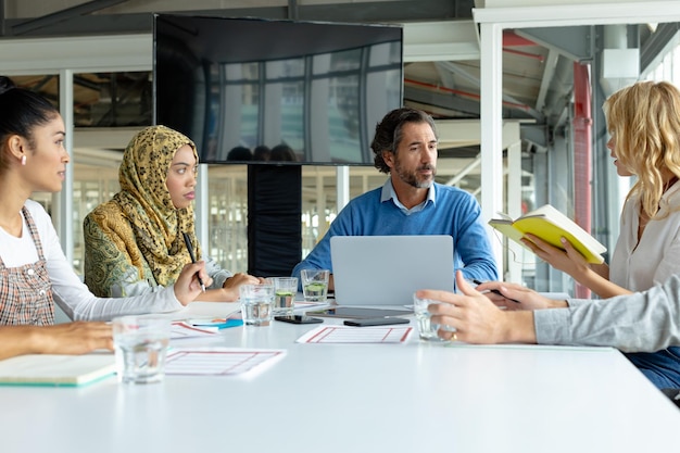 business people discussing with each other in meeting at conference room in a modern office